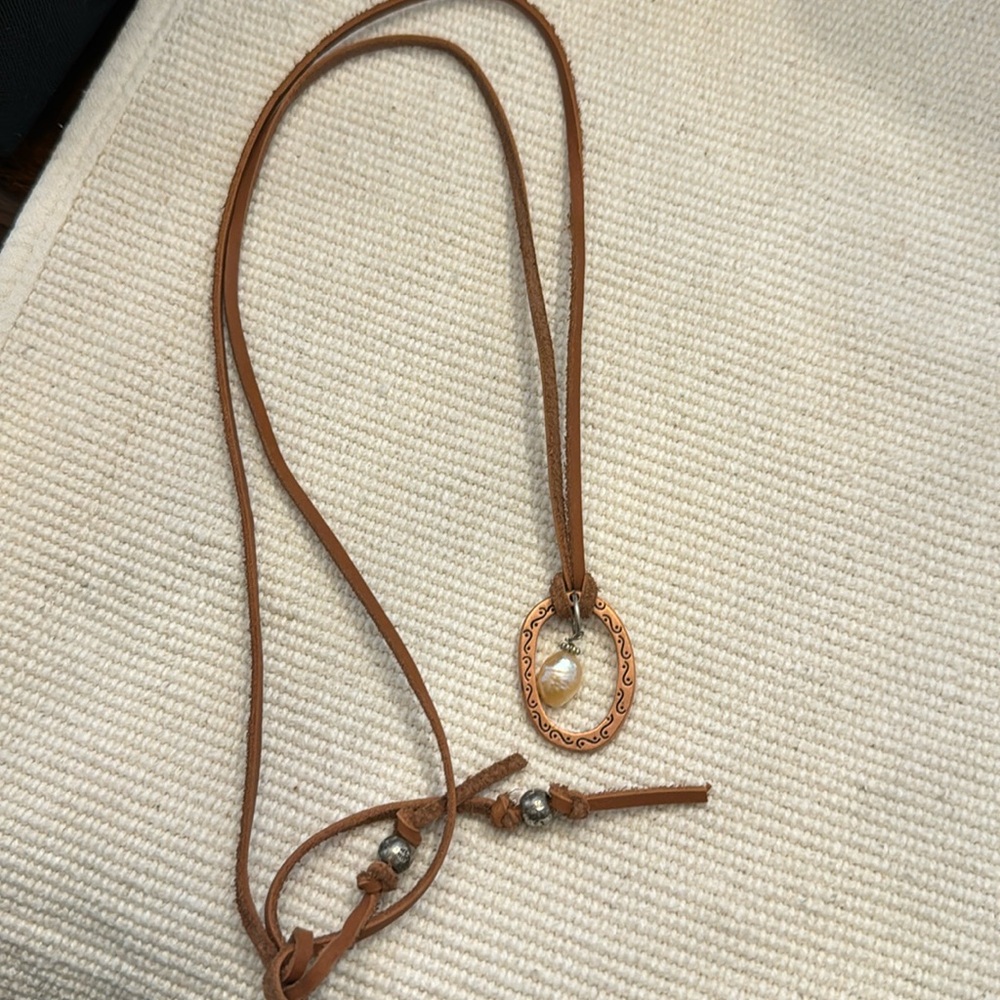 Leather cord necklace with pearl and copper charm